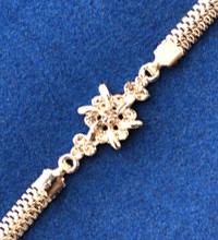 Silver Colored Rakhi with White Stones