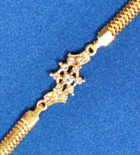 Golden Rakhi Bracelet with White Stones